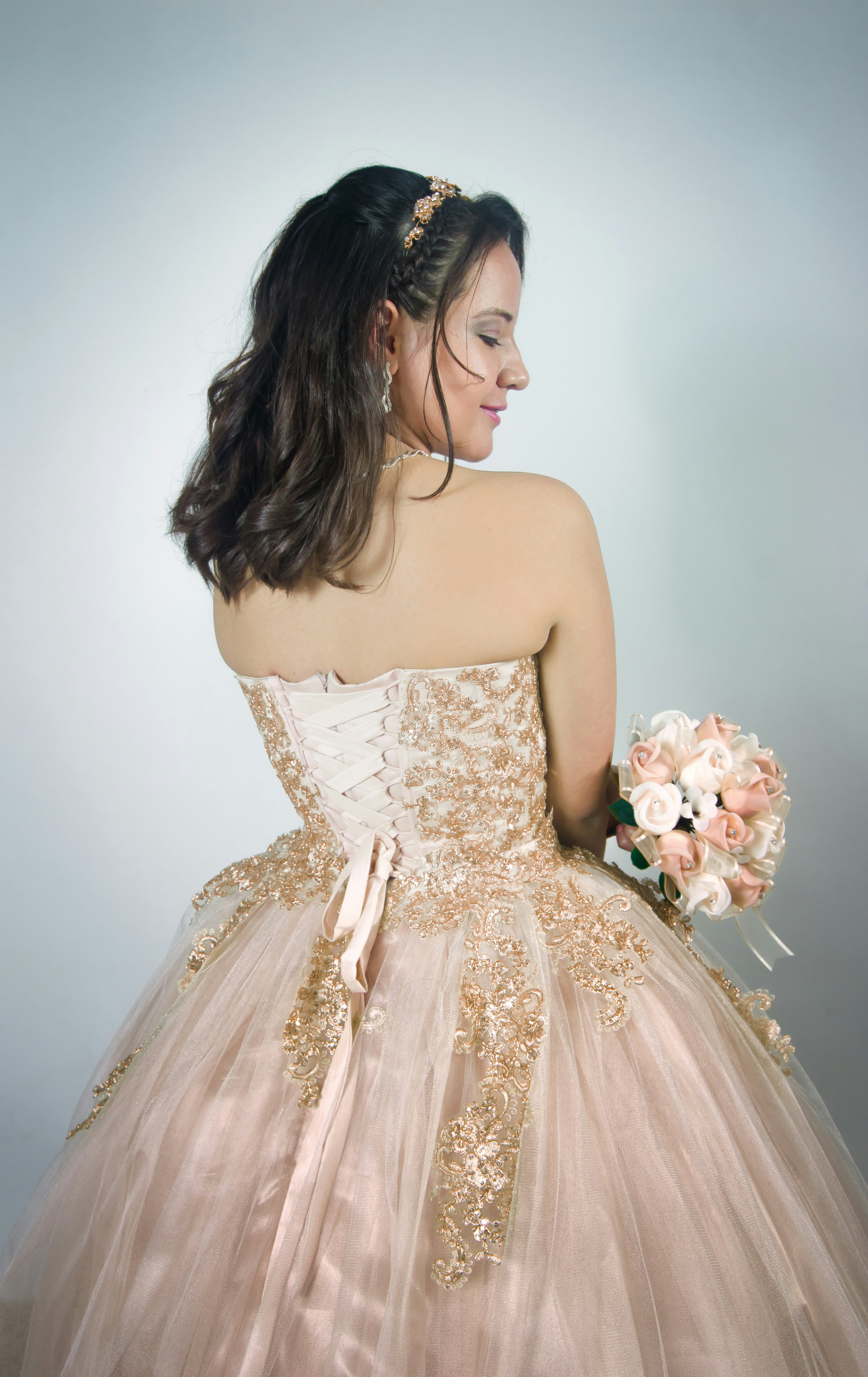 woman wearing pink strapless gown